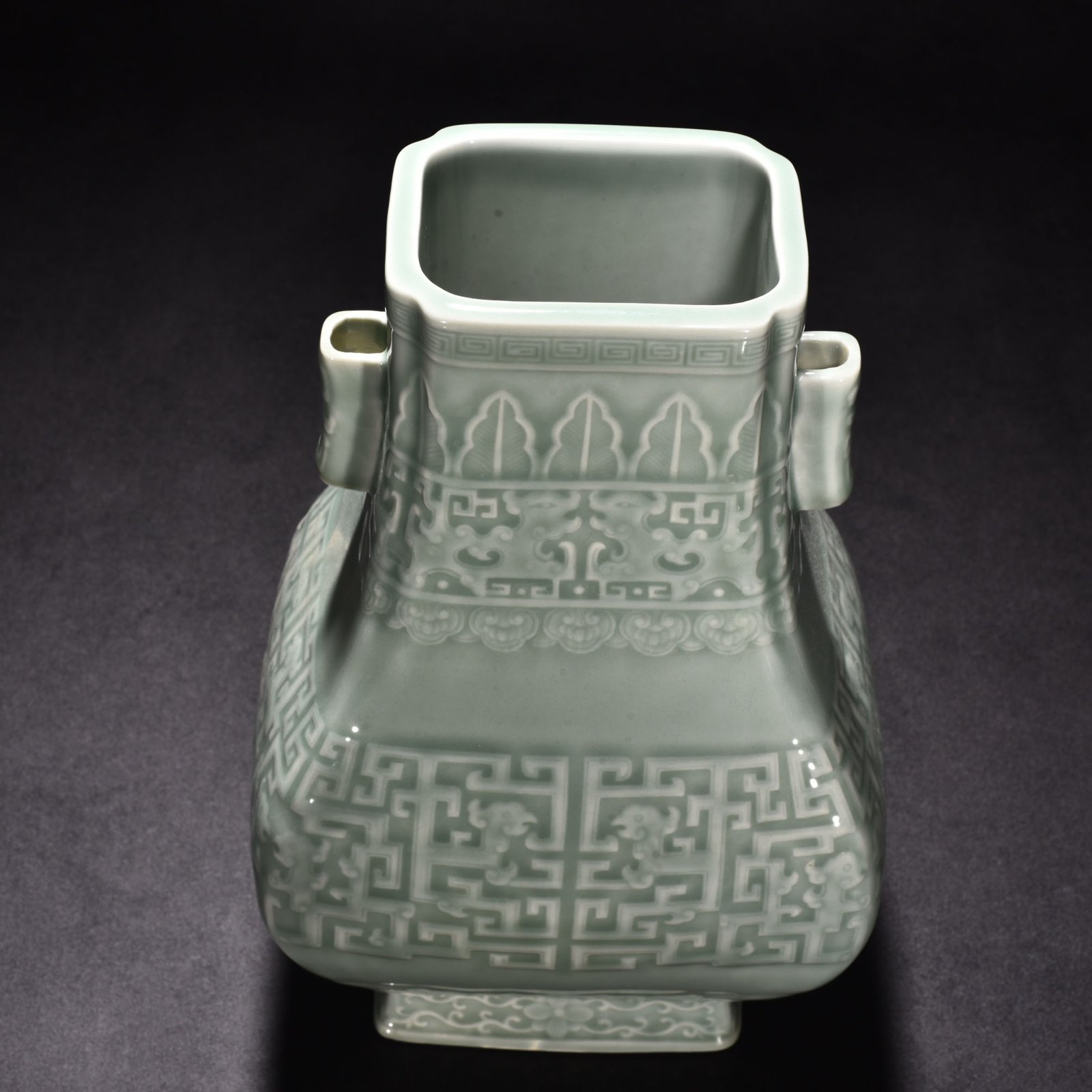 Qing Dynasty Qianlong pink celadon glaze carved Kui dragon through the ear vase