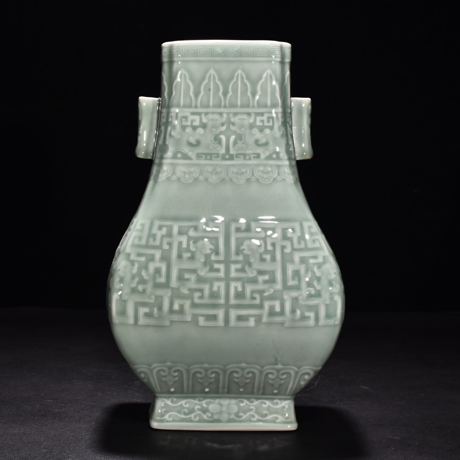 Qing Dynasty Qianlong pink celadon glaze carved Kui dragon through-ear bottle
