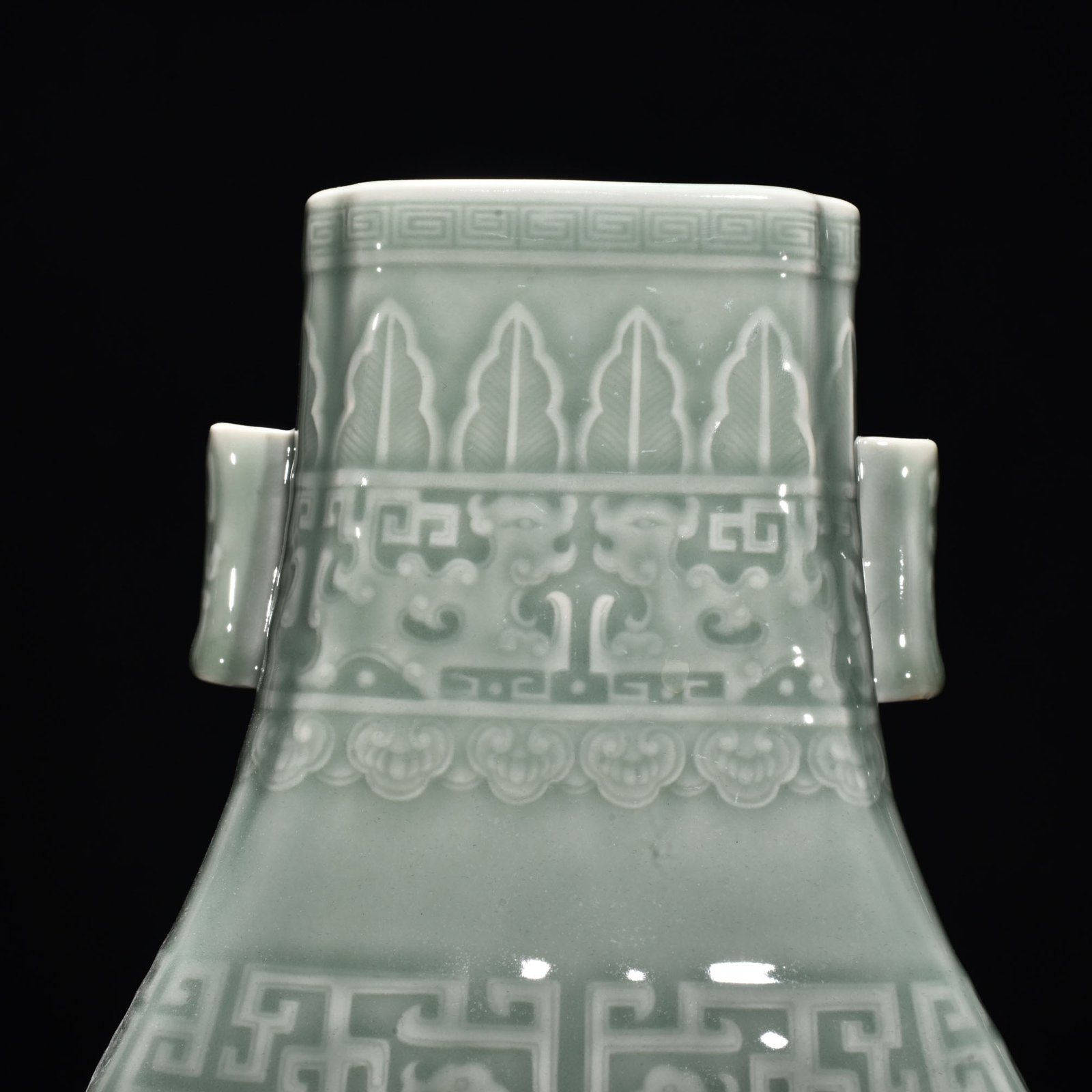 Qing Dynasty Qianlong pink celadon glaze carved Kui dragon through-ear bottle