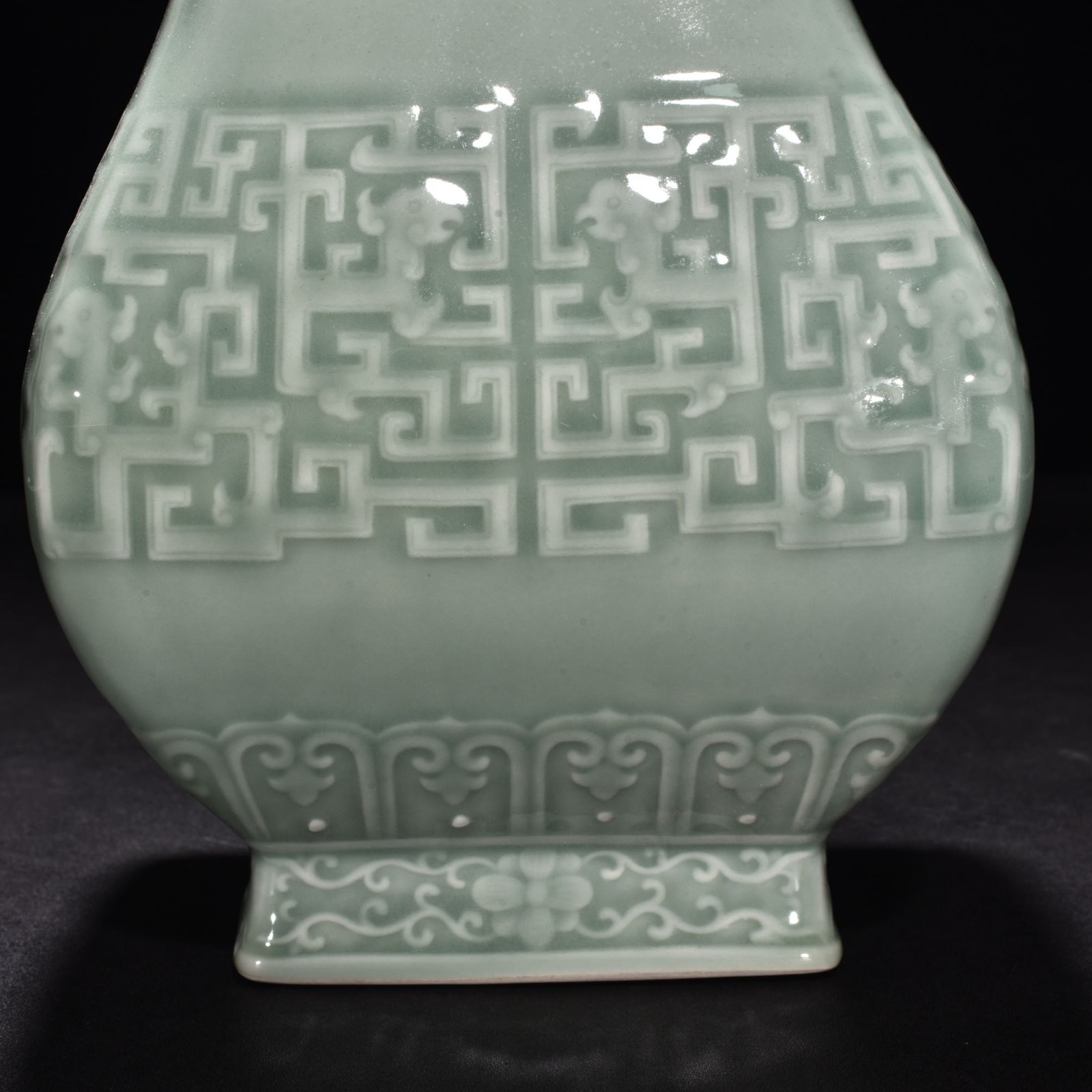 Qing Dynasty Qianlong pink celadon glaze carved Kui dragon through-ear bottle