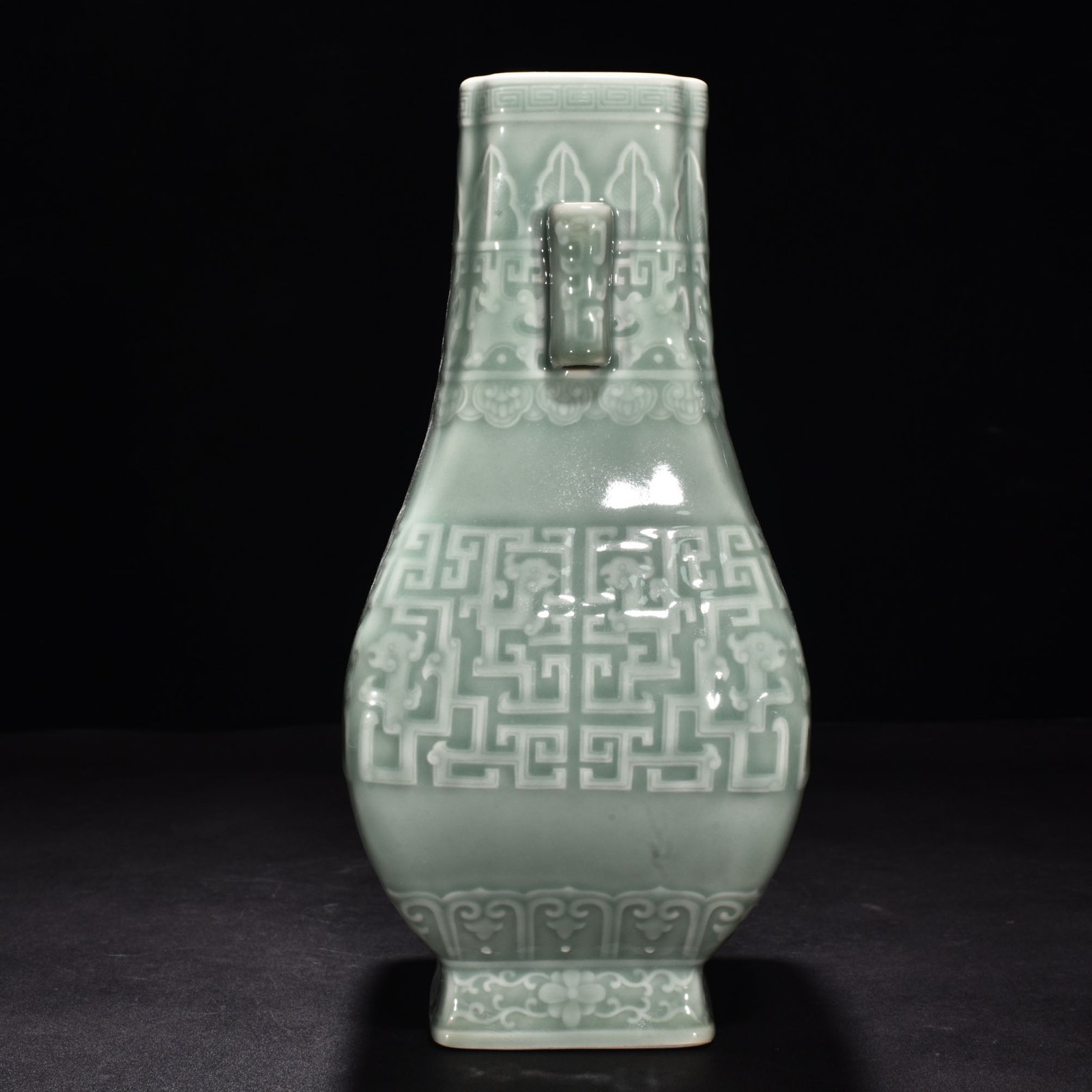Qing Dynasty Qianlong pink celadon glaze carved Kui dragon through-ear bottle