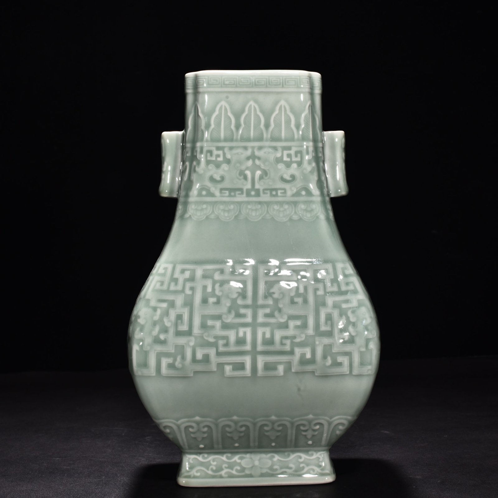 Qing Dynasty Qianlong pink celadon glaze carved Kui dragon through-ear bottle