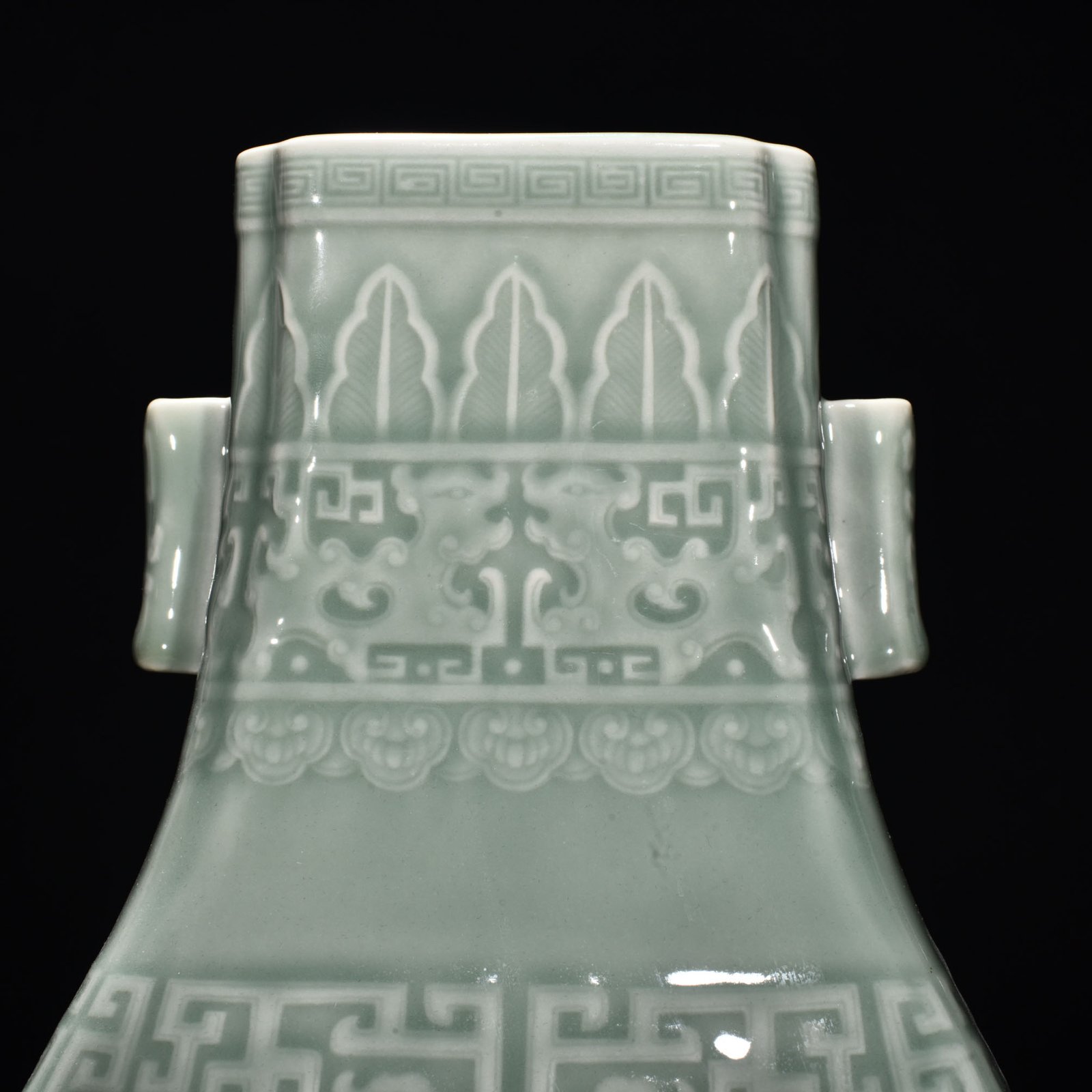 Qing Dynasty Qianlong pink celadon glaze carved Kui dragon through-ear bottle