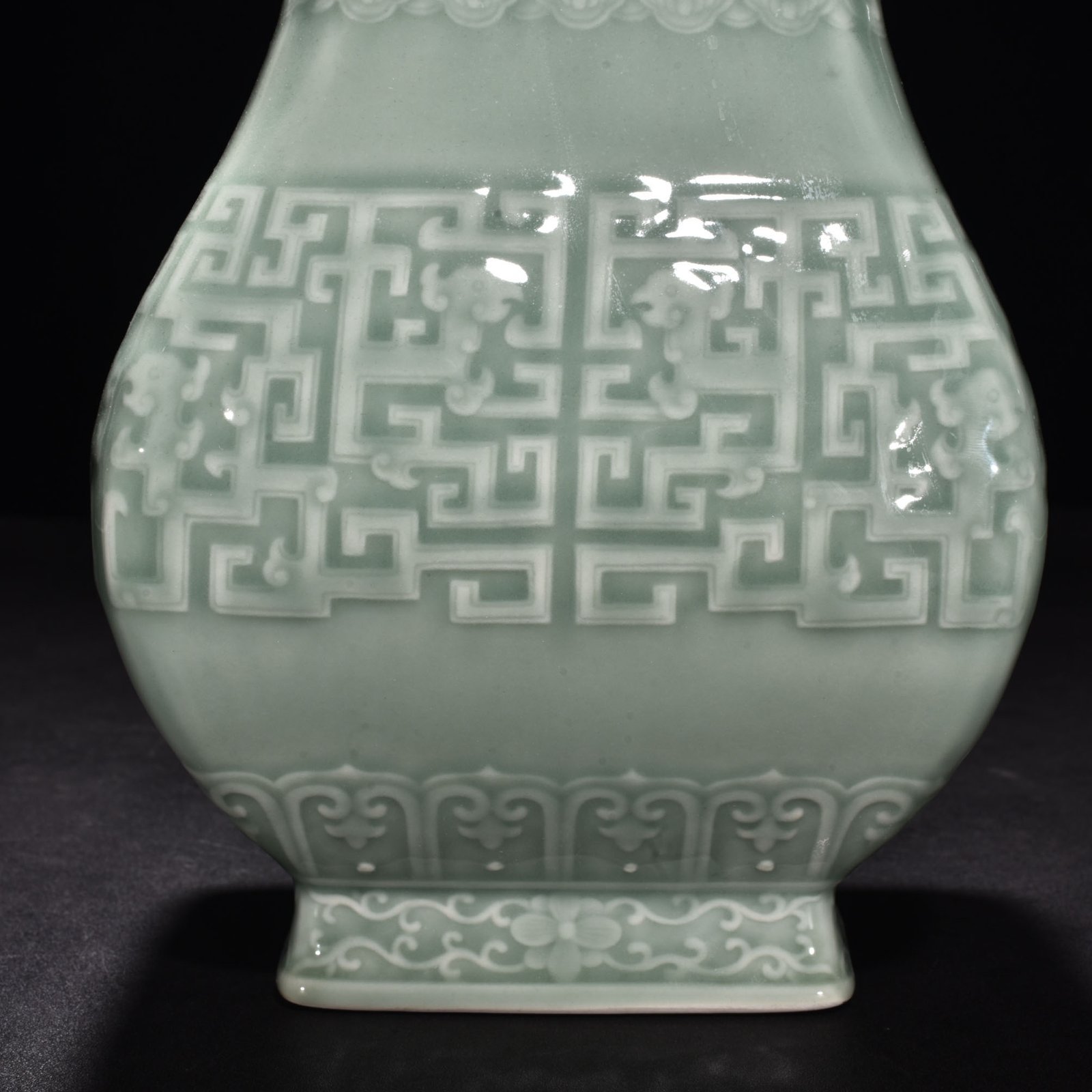 Qing Dynasty Qianlong pink celadon glaze carved Kui dragon through-ear bottle