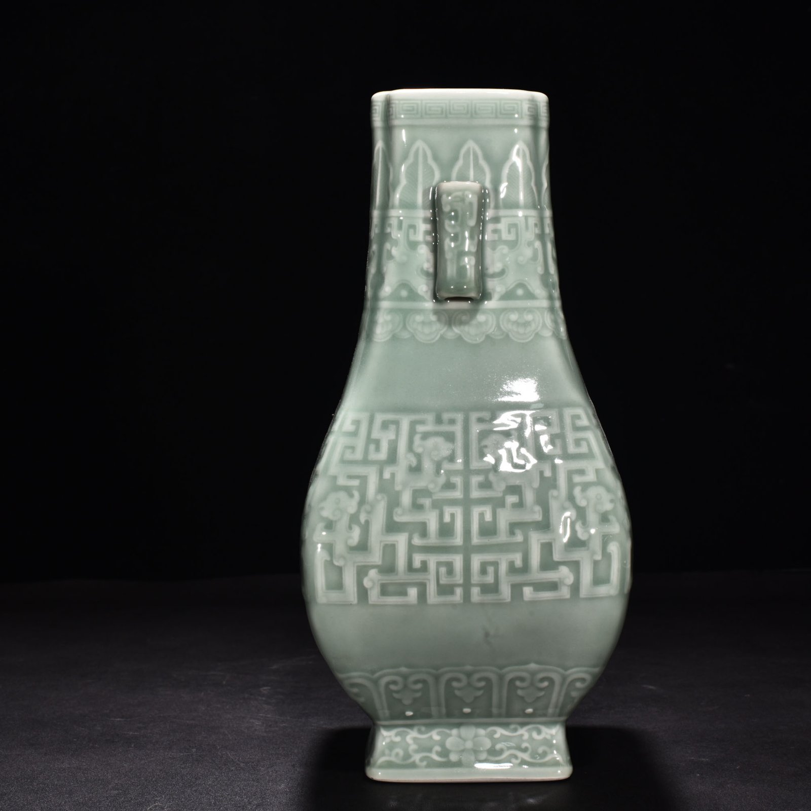 Qing Dynasty Qianlong pink celadon glaze carved Kui dragon through-ear bottle