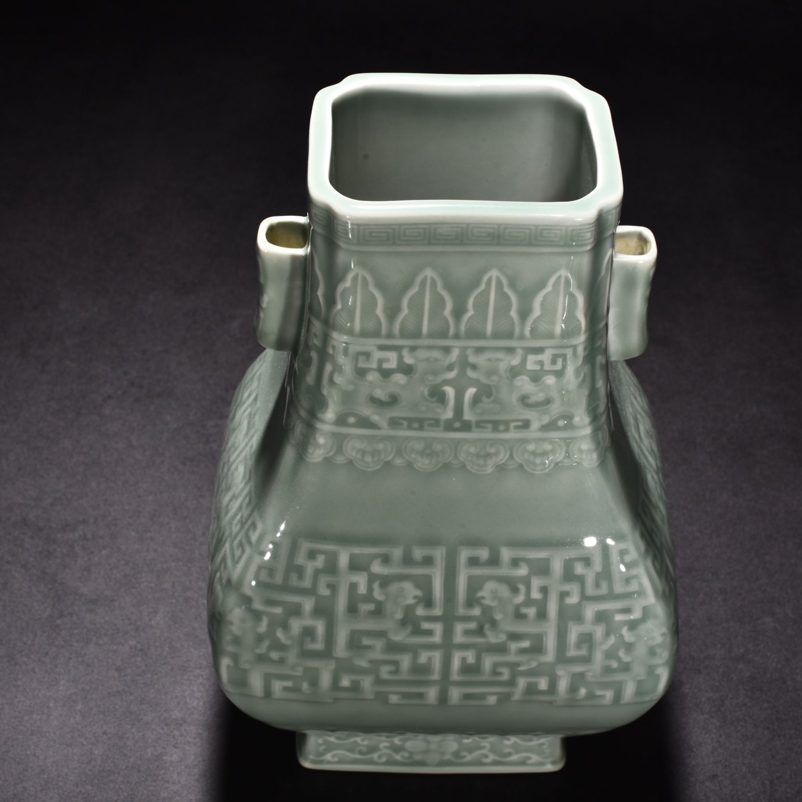 Qing Dynasty Qianlong pink celadon glaze carved Kui dragon through-ear bottle