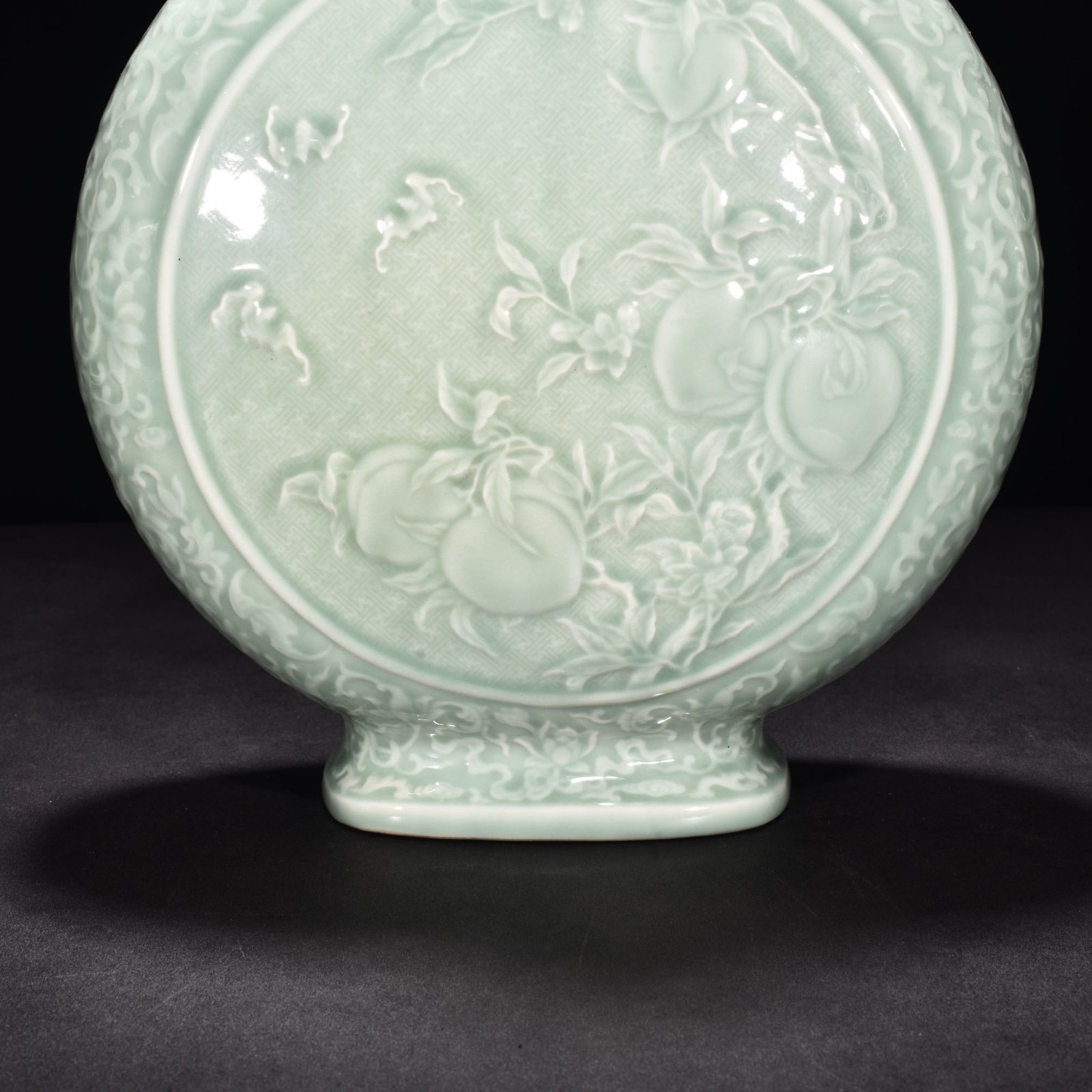 Qing Dynasty Qianlong pink celadon glaze carved flat vase with many children