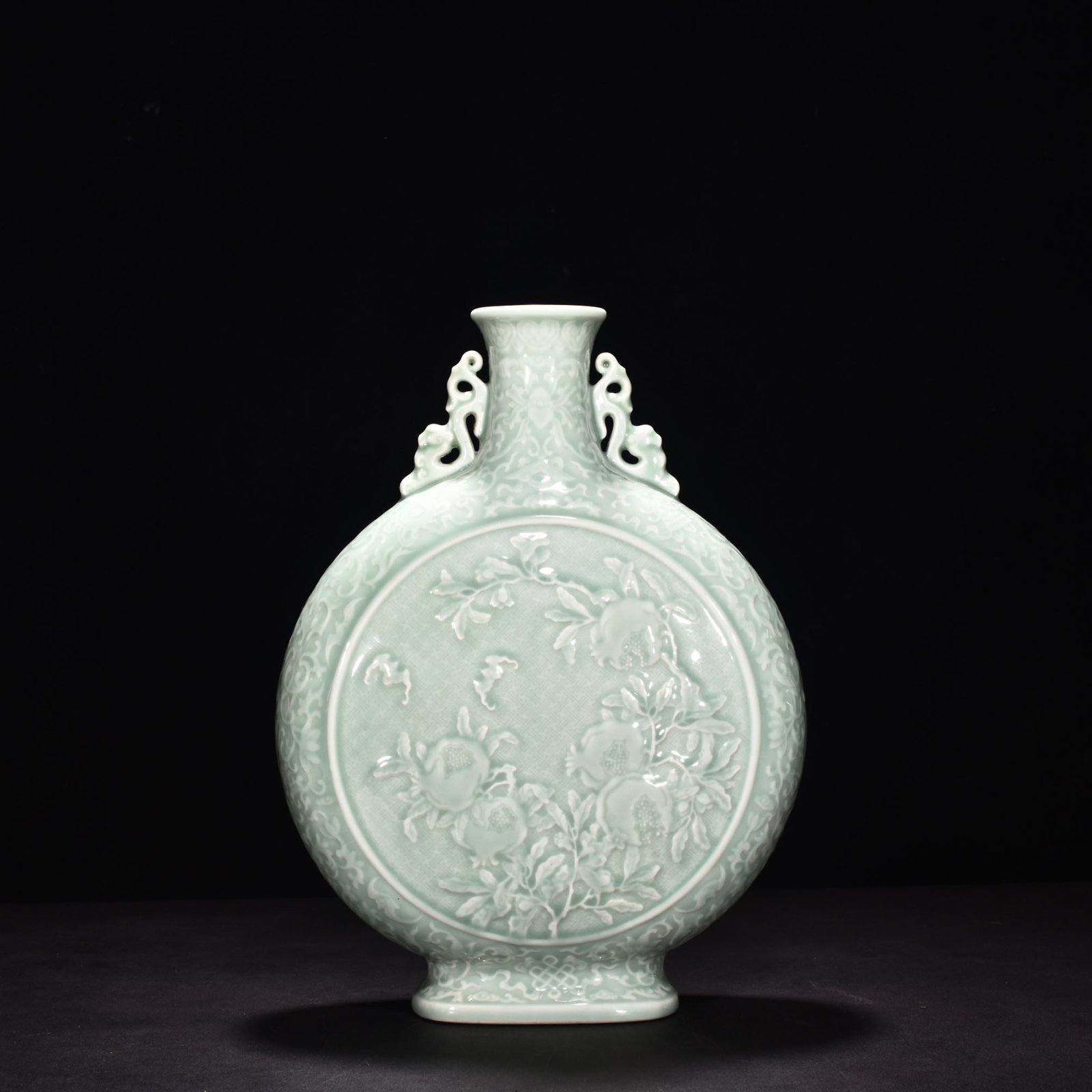 Qing Dynasty Qianlong pink celadon glaze carved flat vase with many children