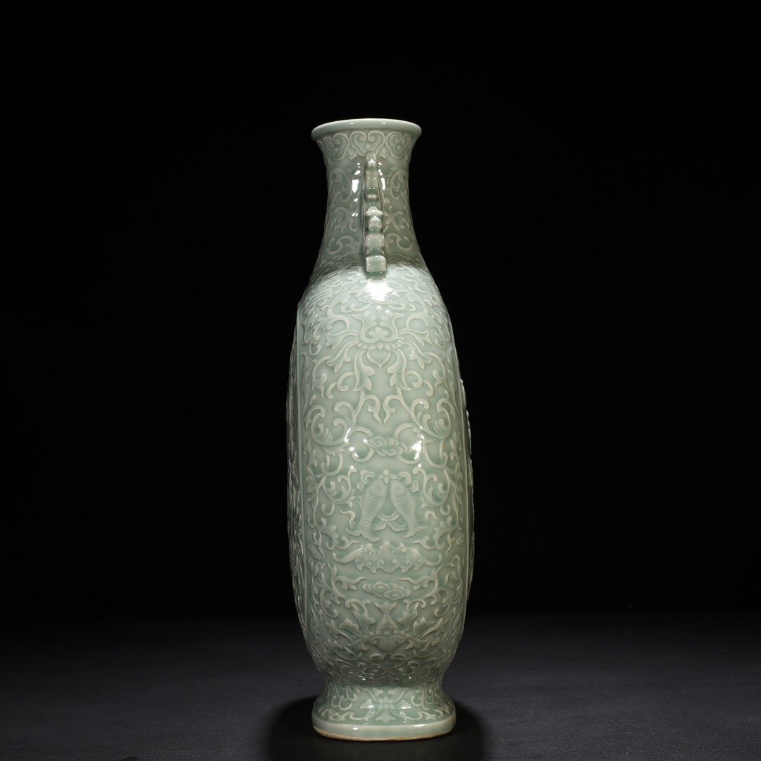 Qing Dynasty Qianlong pink celadon glaze carved longevity and multi-child holding moon vase
