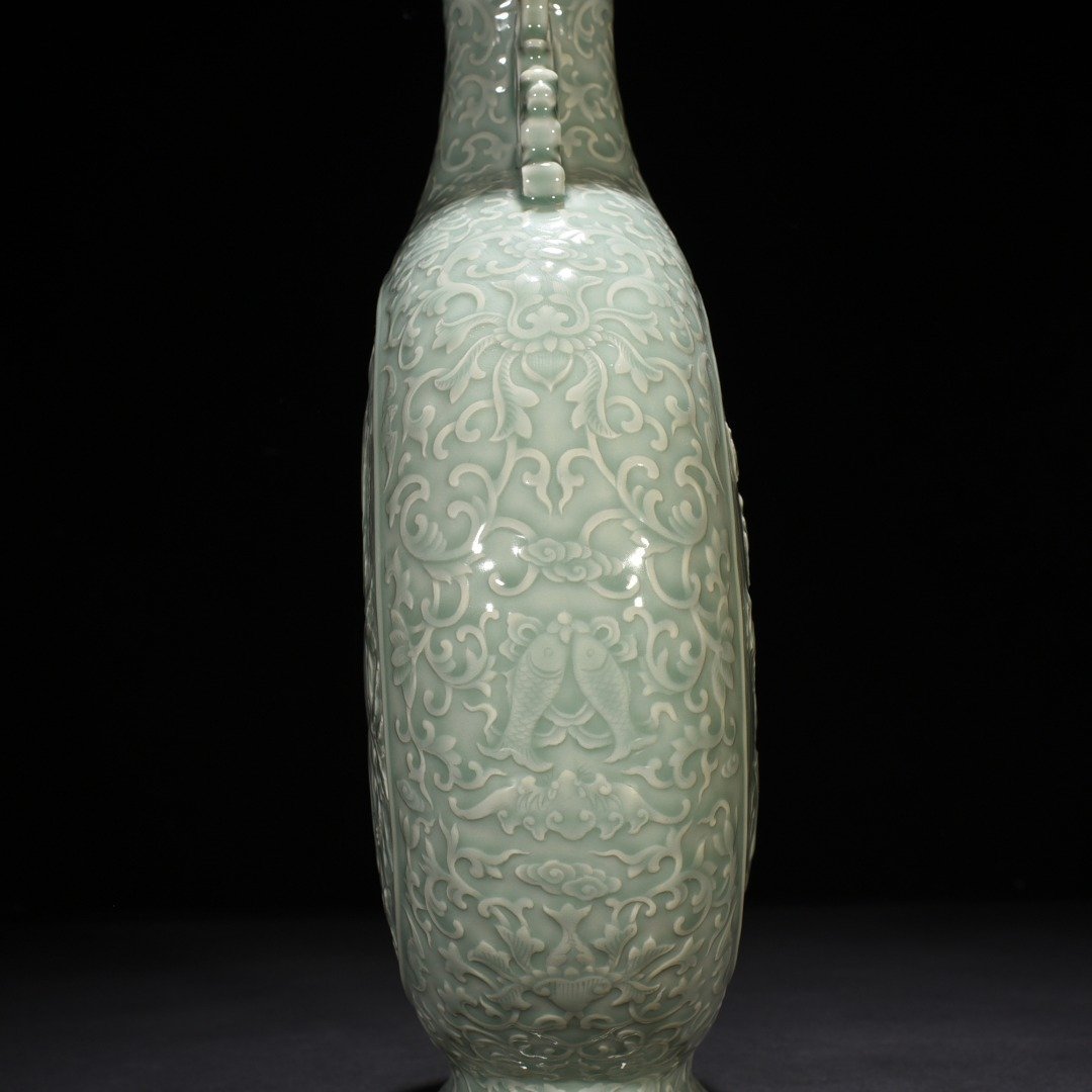 Qing Dynasty Qianlong pink celadon glaze carved longevity and multi-child holding moon vase