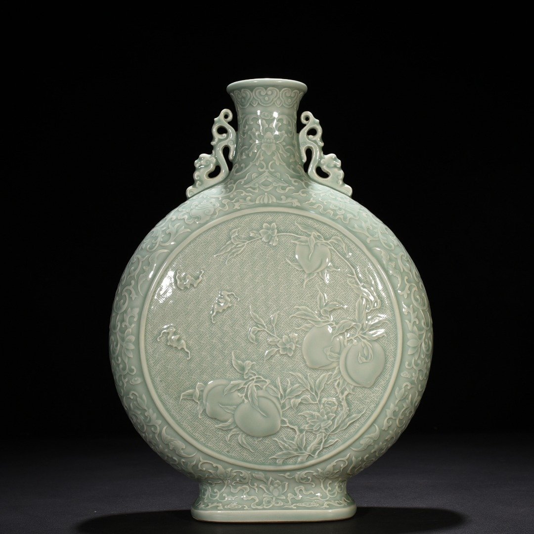 Qing Dynasty Qianlong pink celadon glaze carved longevity and multi-child holding moon vase