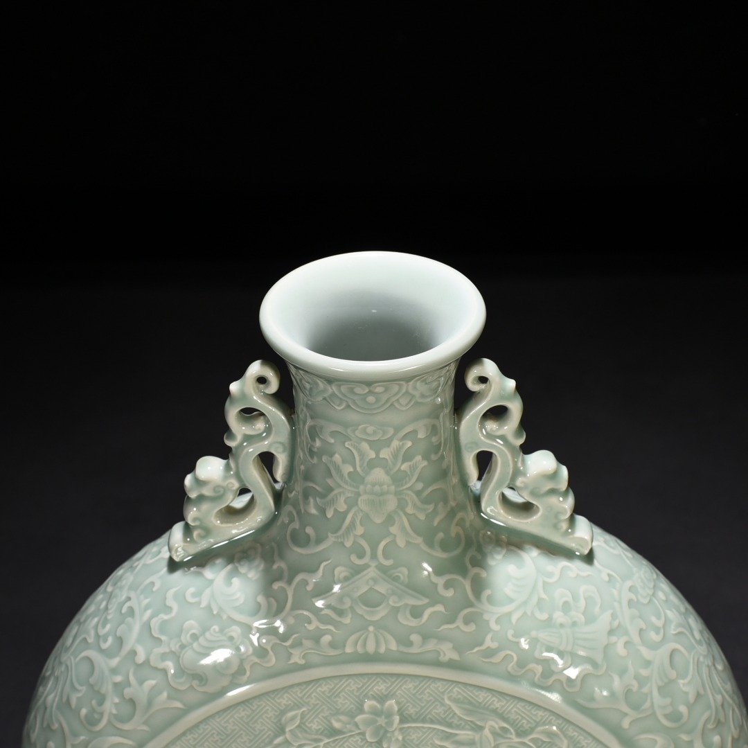 Qing Dynasty Qianlong pink celadon glaze carved longevity and multi-child holding moon vase