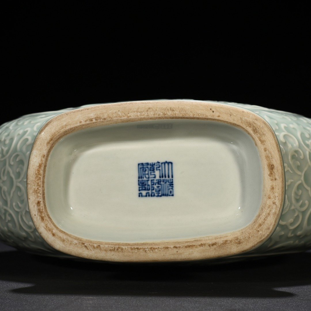 Qing Dynasty Qianlong pink celadon glaze carved longevity and multi-child holding moon vase