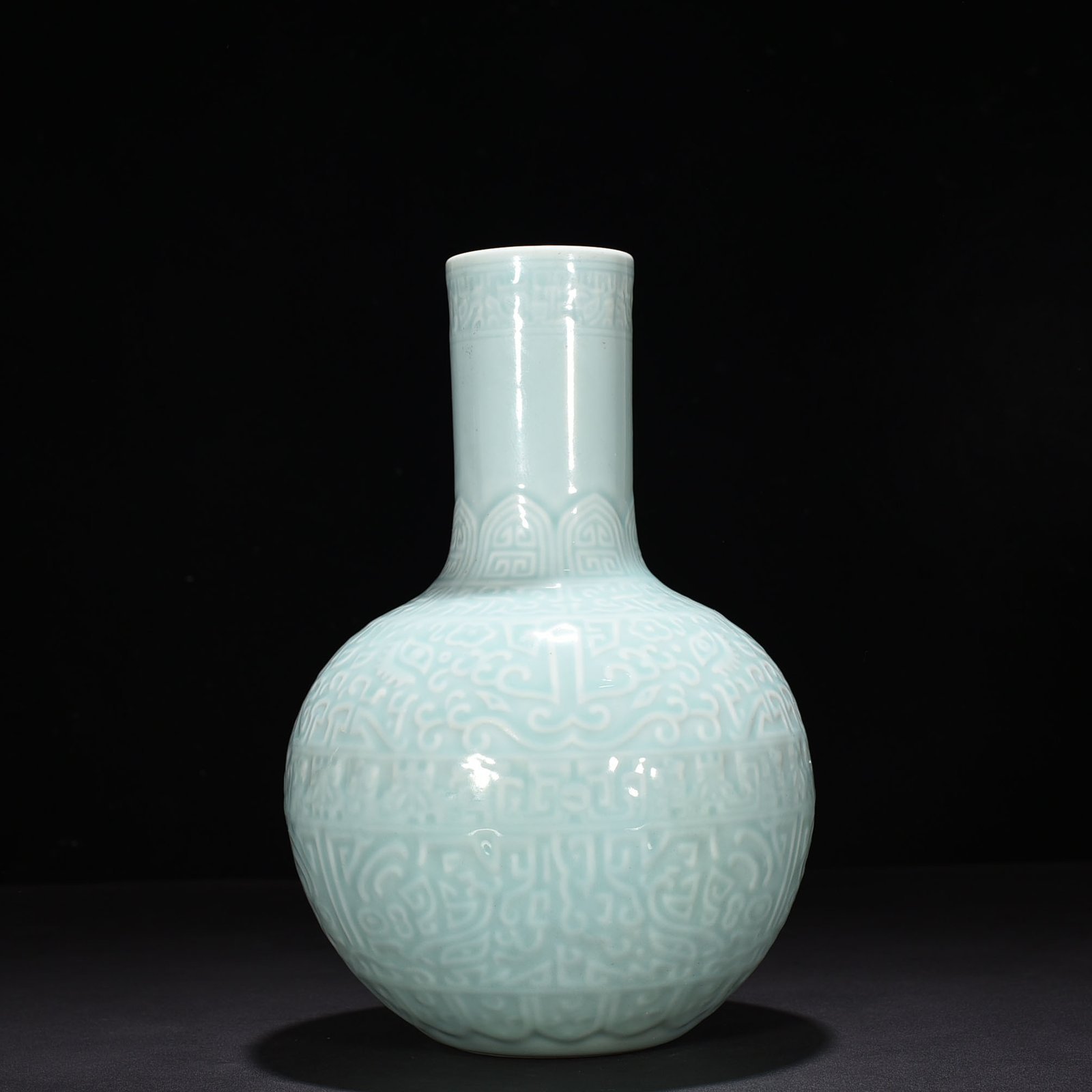Qing Dynasty Qianlong pink celadon glaze carved Taotie celestial sphere vase