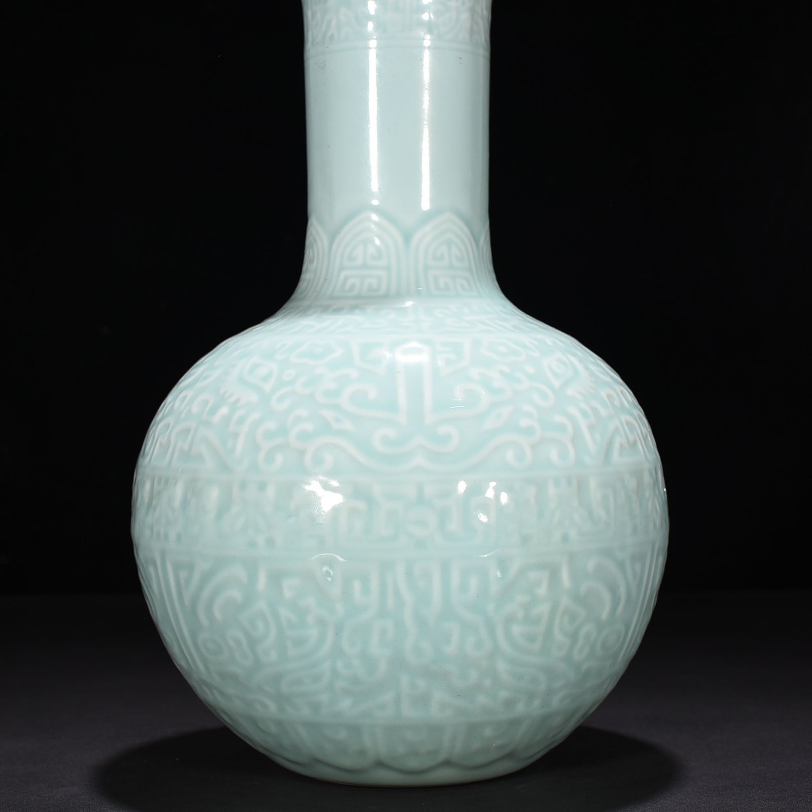 Qing Dynasty Qianlong pink celadon glaze carved Taotie celestial sphere vase