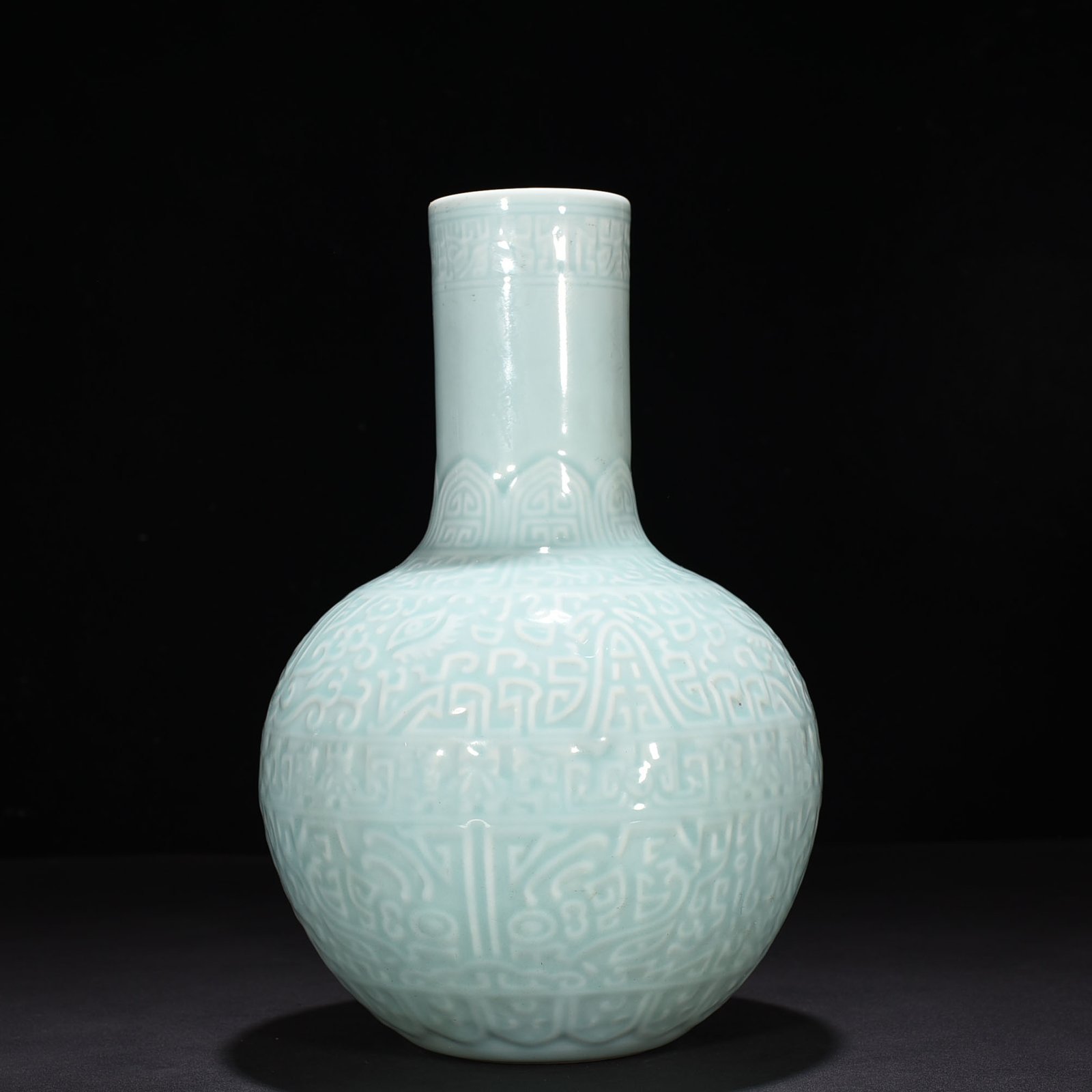 Qing Dynasty Qianlong pink celadon glaze carved Taotie celestial sphere vase