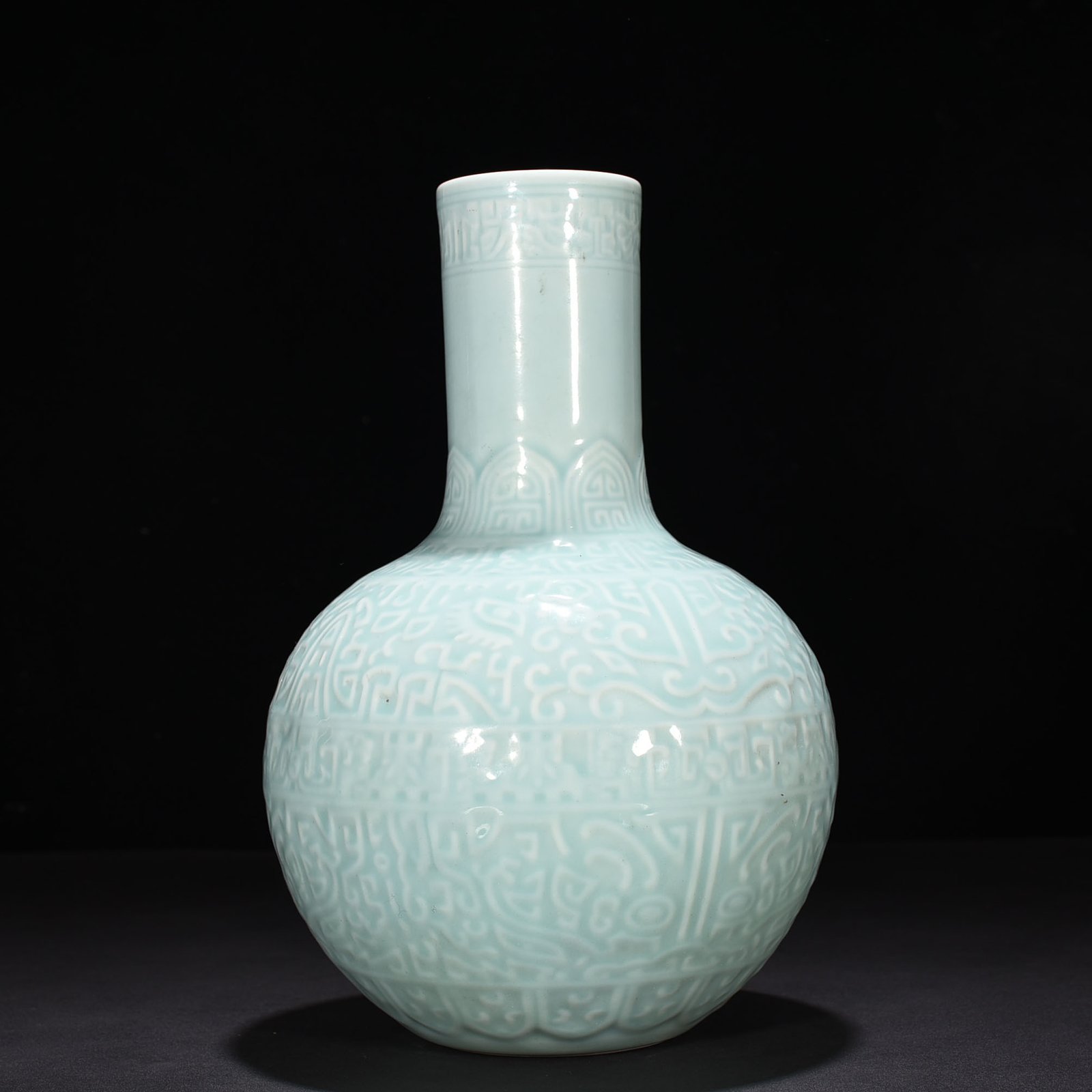 Qing Dynasty Qianlong pink celadon glaze carved Taotie celestial sphere vase