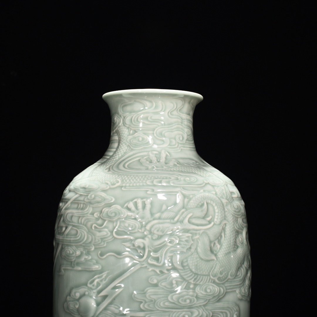 Qing Dynasty Qianlong pink celadon glaze carved fish and dragon lantern bottle