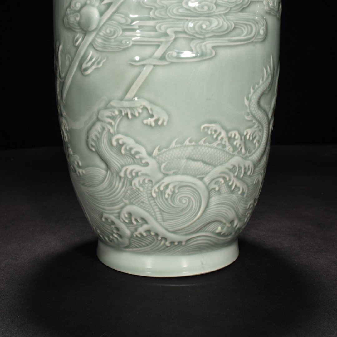 Qing Dynasty Qianlong pink celadon glaze carved fish and dragon lantern bottle