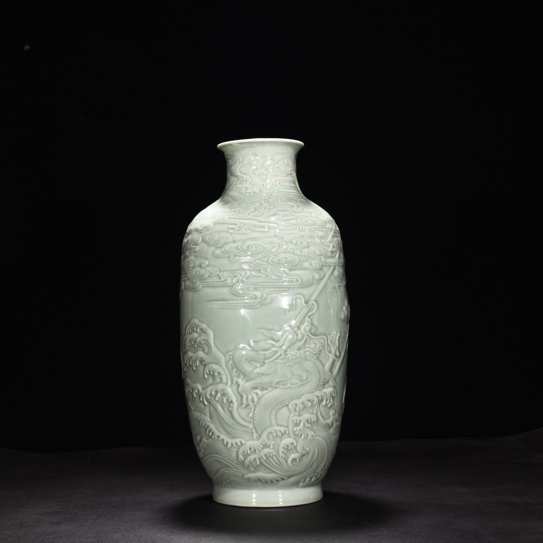 Qing Dynasty Qianlong pink celadon glaze carved fish and dragon lantern bottle