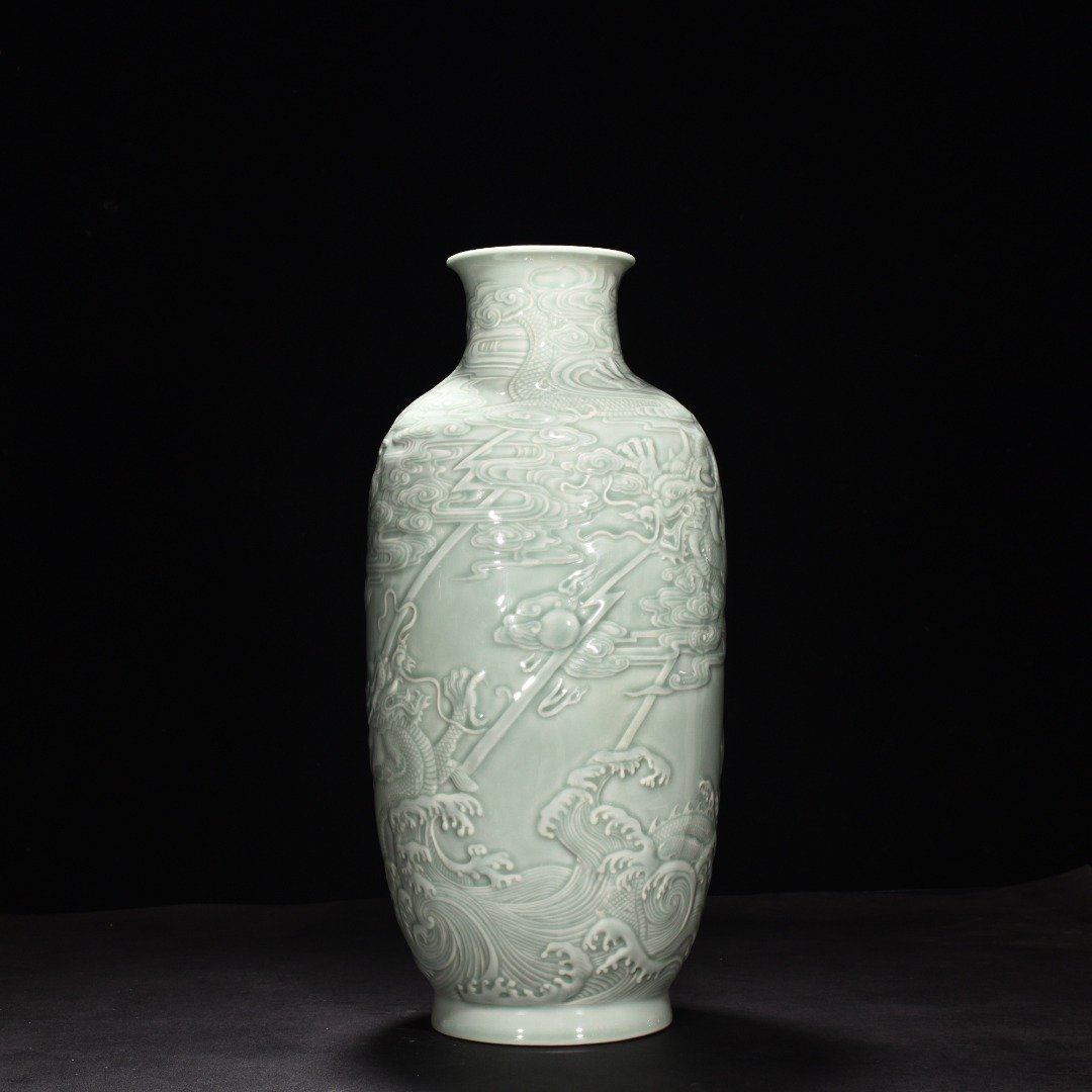 Qing Dynasty Qianlong pink celadon glaze carved fish and dragon lantern bottle