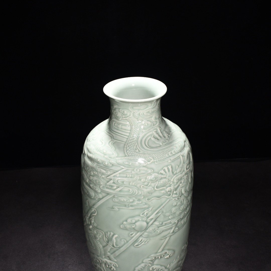 Qing Dynasty Qianlong pink celadon glaze carved fish and dragon lantern bottle