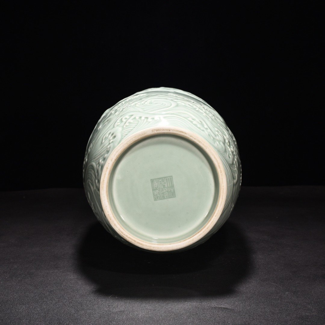 Qing Dynasty Qianlong pink celadon glaze carved fish and dragon lantern bottle