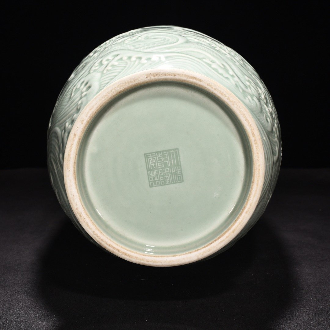 Qing Dynasty Qianlong pink celadon glaze carved fish and dragon lantern bottle