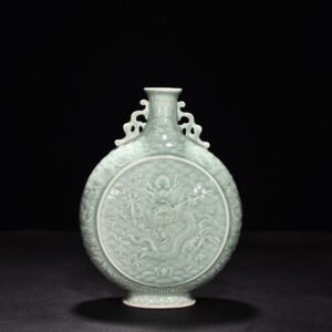 Qing Dynasty Qianlong pink celadon glaze carved dragon and phoenix double-eared flat vase
