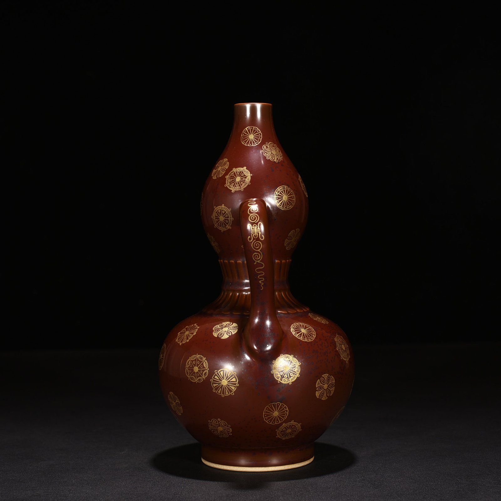 Qing Dynasty Qianlong purple gold glaze with gold leather ball Ruyi ear gourd vase