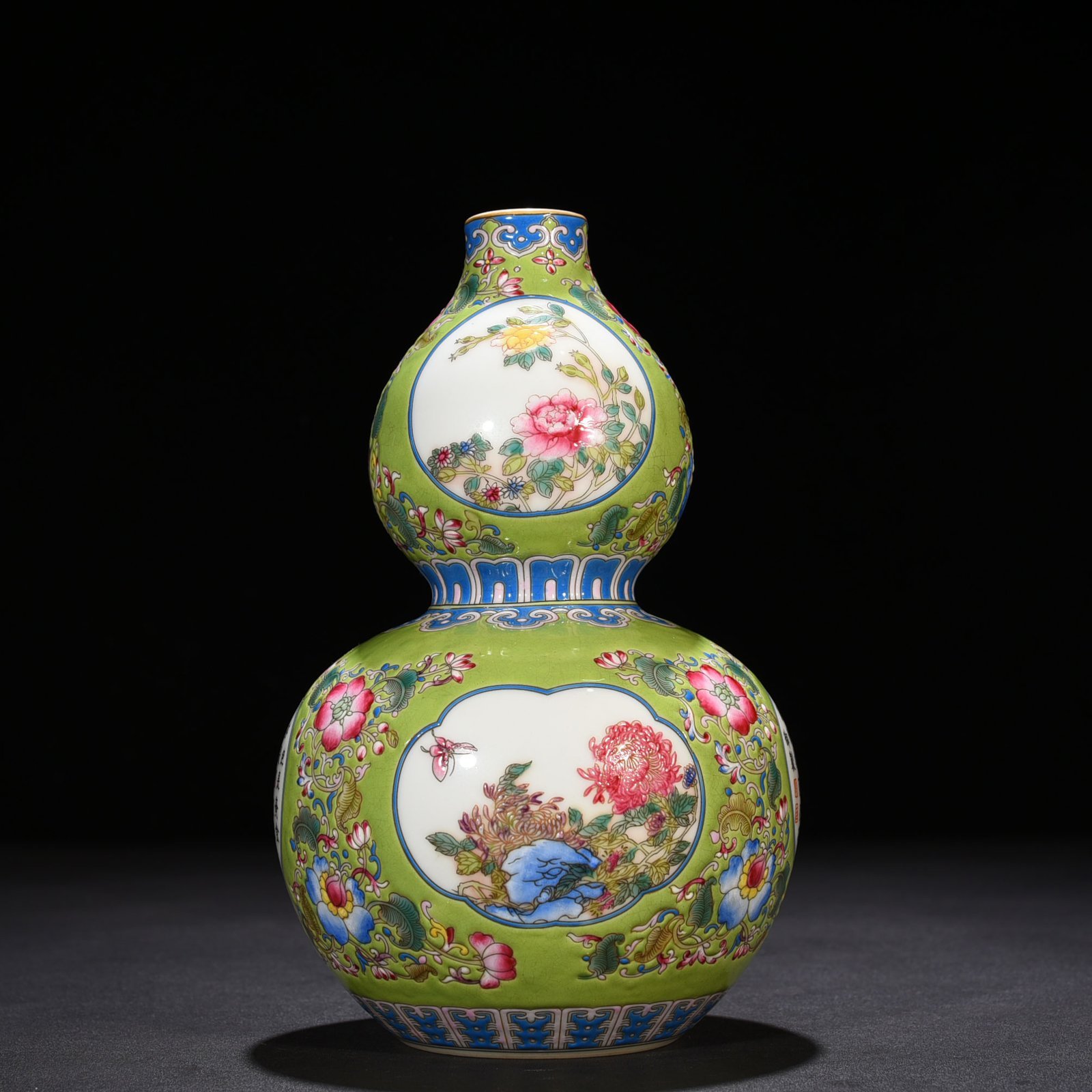 Qing Dynasty Qianlong green space enamel gourd vase with floral verse