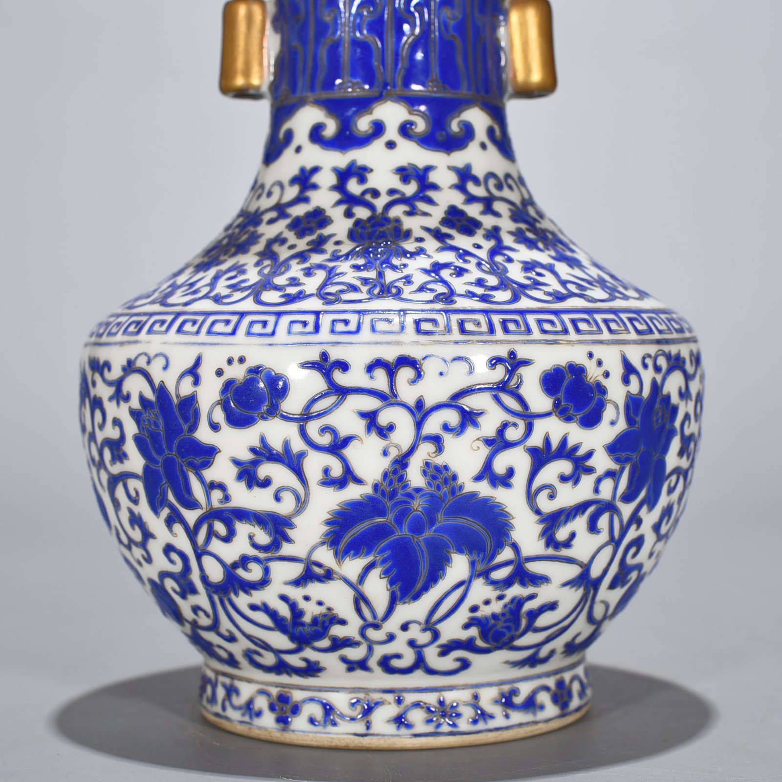Qing Dynasty Qianlong blue with colorful intertwined branches and florals vase