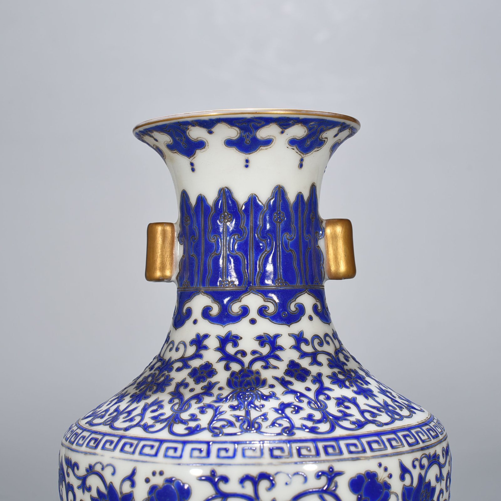 Qing Dynasty Qianlong blue with colorful intertwined branches and florals vase