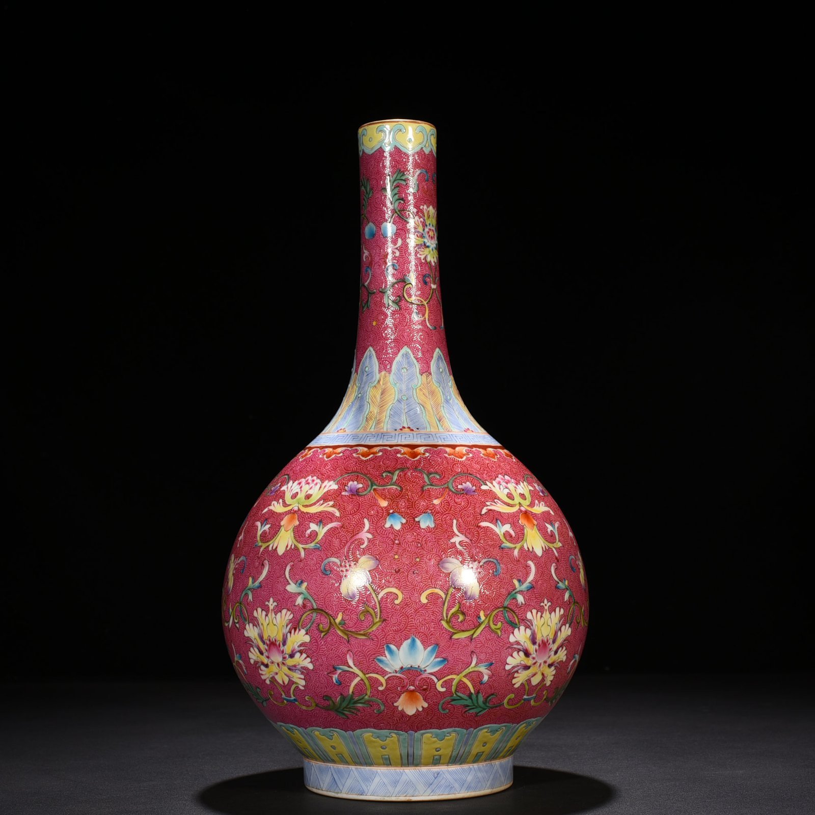 Qing Dynasty Qianlong rolling rouge ground pastel flower vase