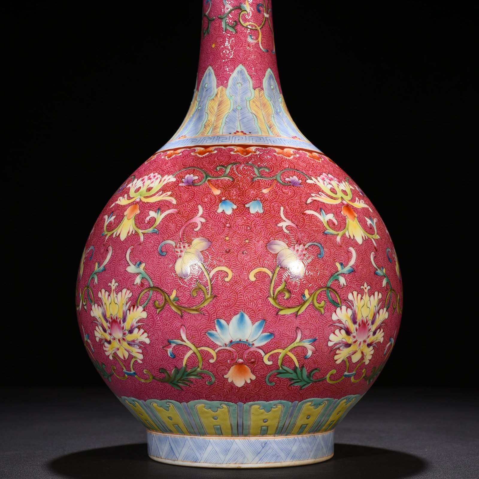 Qing Dynasty Qianlong rolling rouge ground pastel flower vase
