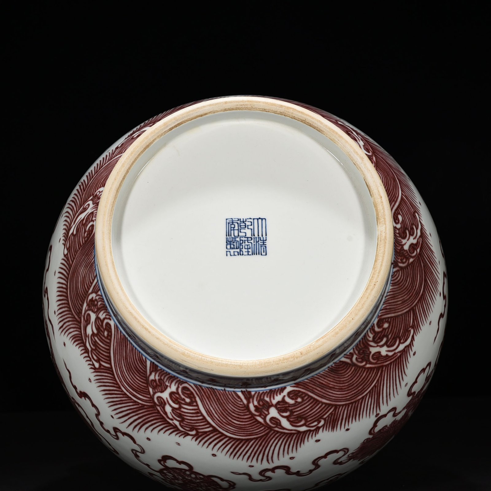 Qing Dynasty Qianlong underglaze red lion rolling hydrangea double-eared statue