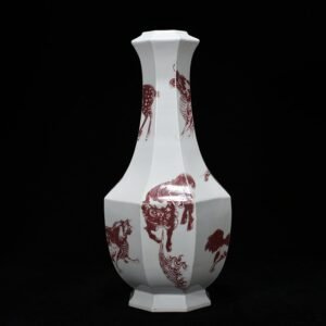 Qing Dynasty Qianlong glazed red octagonal vase with auspicious animals