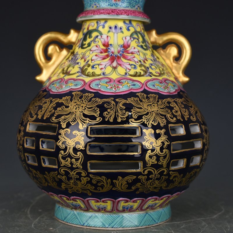 Qing Dynasty Qianlong blue-glazed and gold-embossed hollow bagua binaural vase