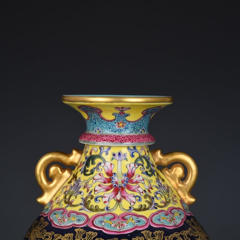 Qing Dynasty Qianlong blue-glazed and gold-embossed hollow bagua binaural vase
