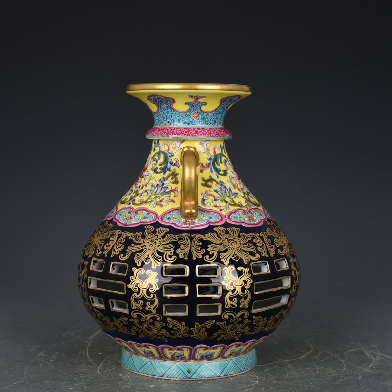 Qing Dynasty Qianlong blue-glazed and gold-embossed hollow bagua binaural vase