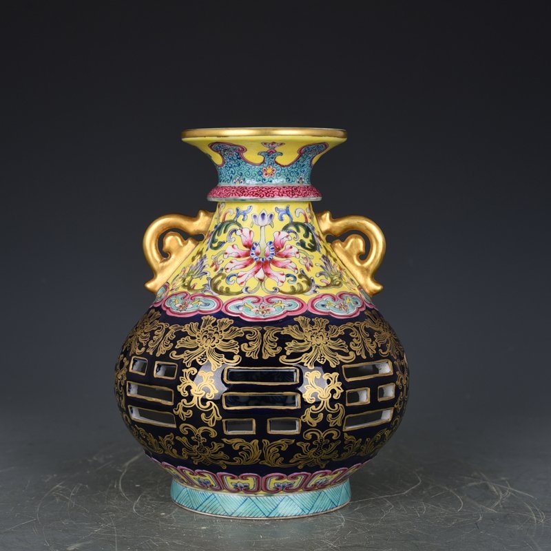 Qing Dynasty Qianlong blue-glazed and gold-embossed hollow bagua binaural vase