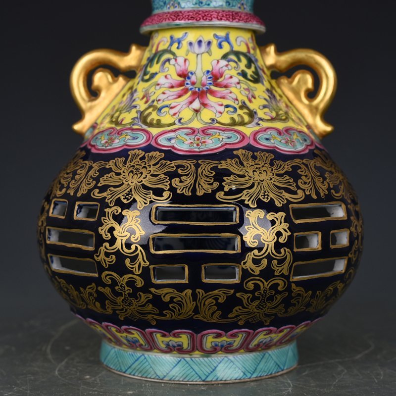 Qing Dynasty Qianlong blue-glazed and gold-embossed hollow bagua binaural vase