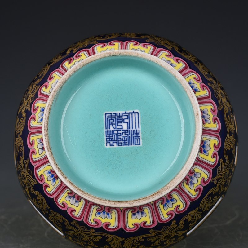 Qing Dynasty Qianlong blue-glazed and gold-embossed hollow bagua binaural vase