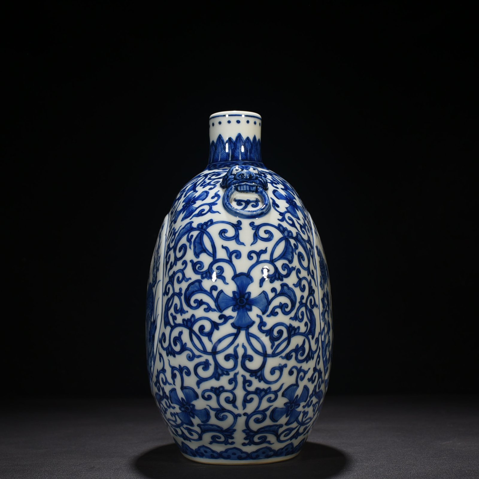 Qing Dynasty Qianlong blue and white windowed four-season flower animal ear flat vase