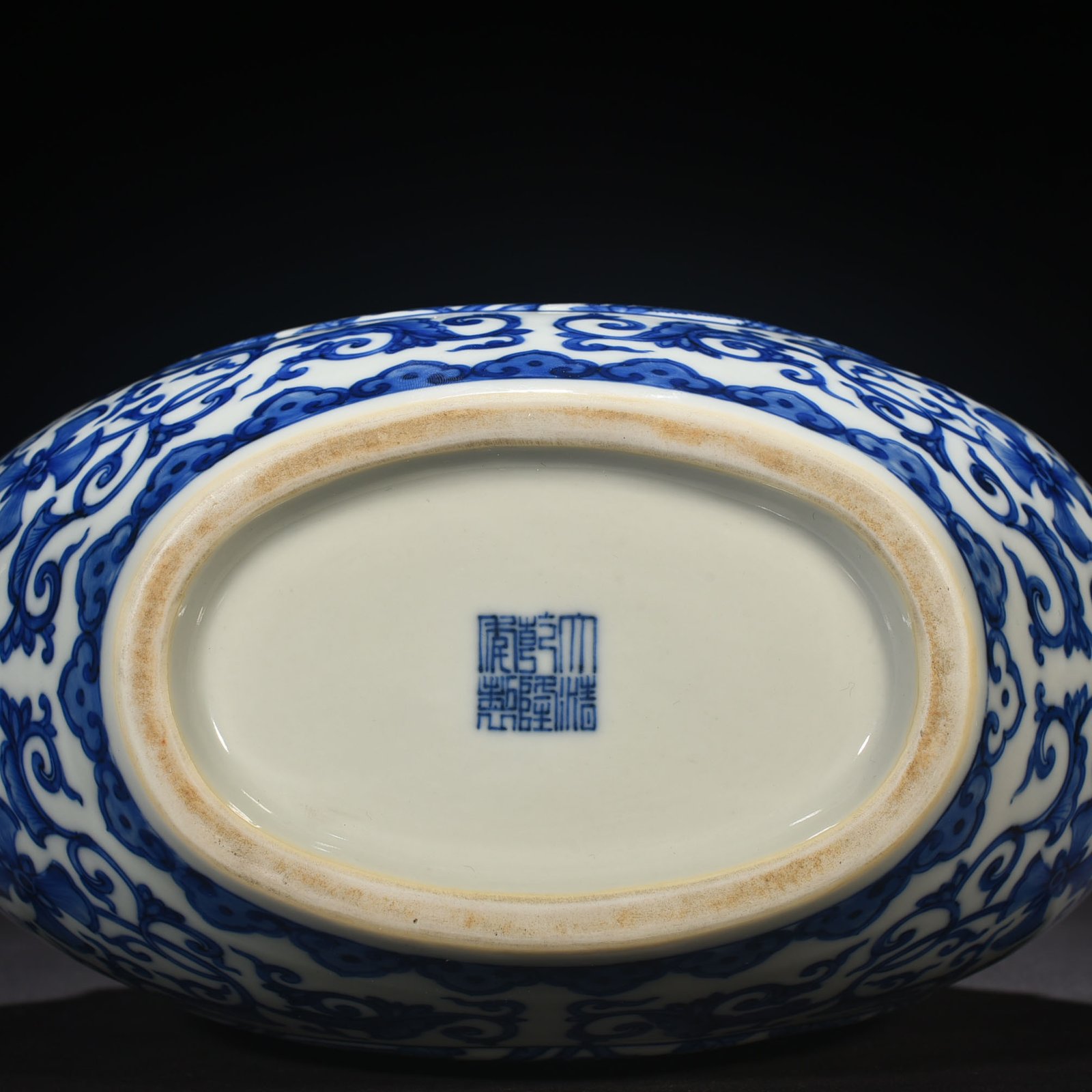 Qing Dynasty Qianlong blue and white windowed four-season flower animal ear flat vase