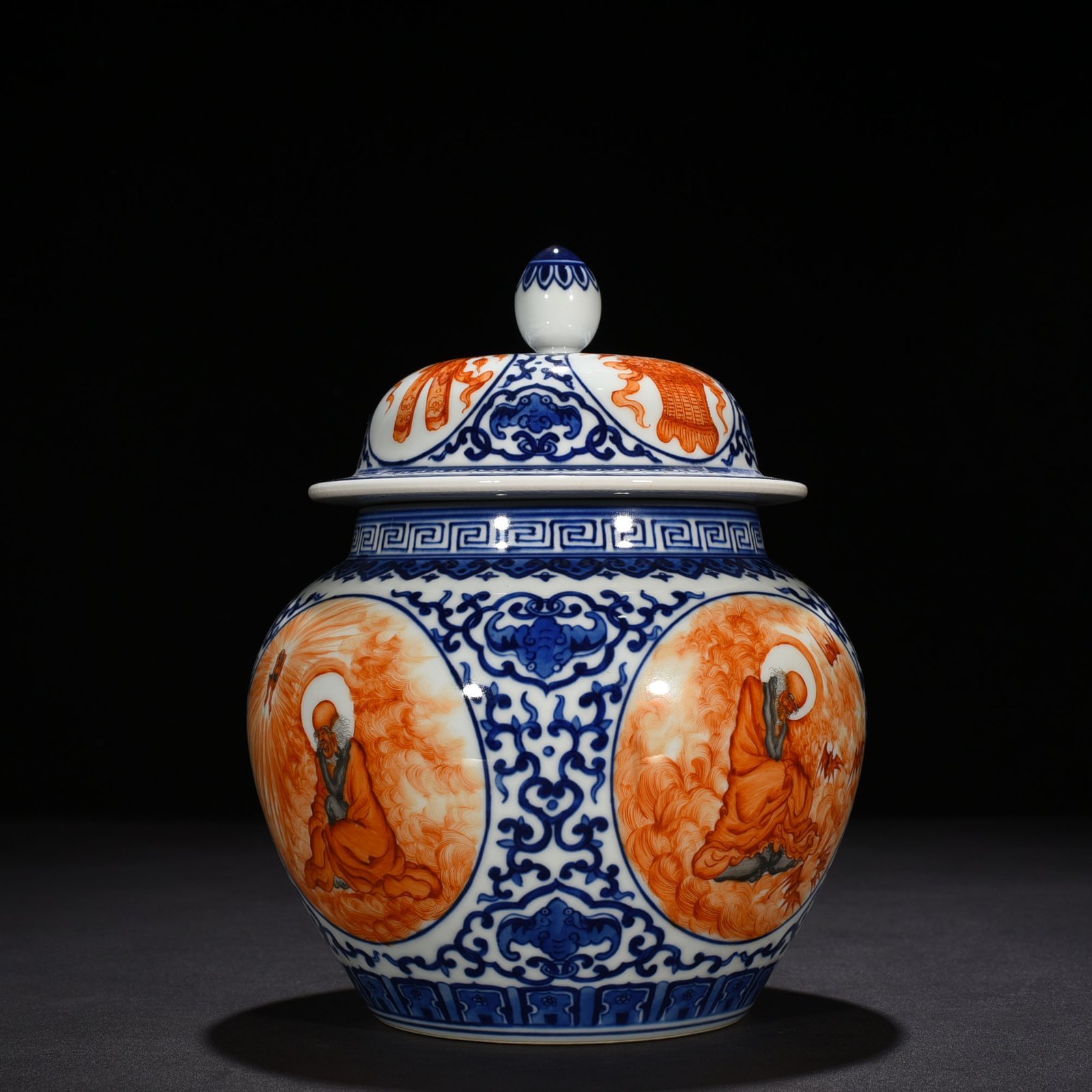 Qing Dynasty Qianlong blue and white windowed alum red Arhat general jar