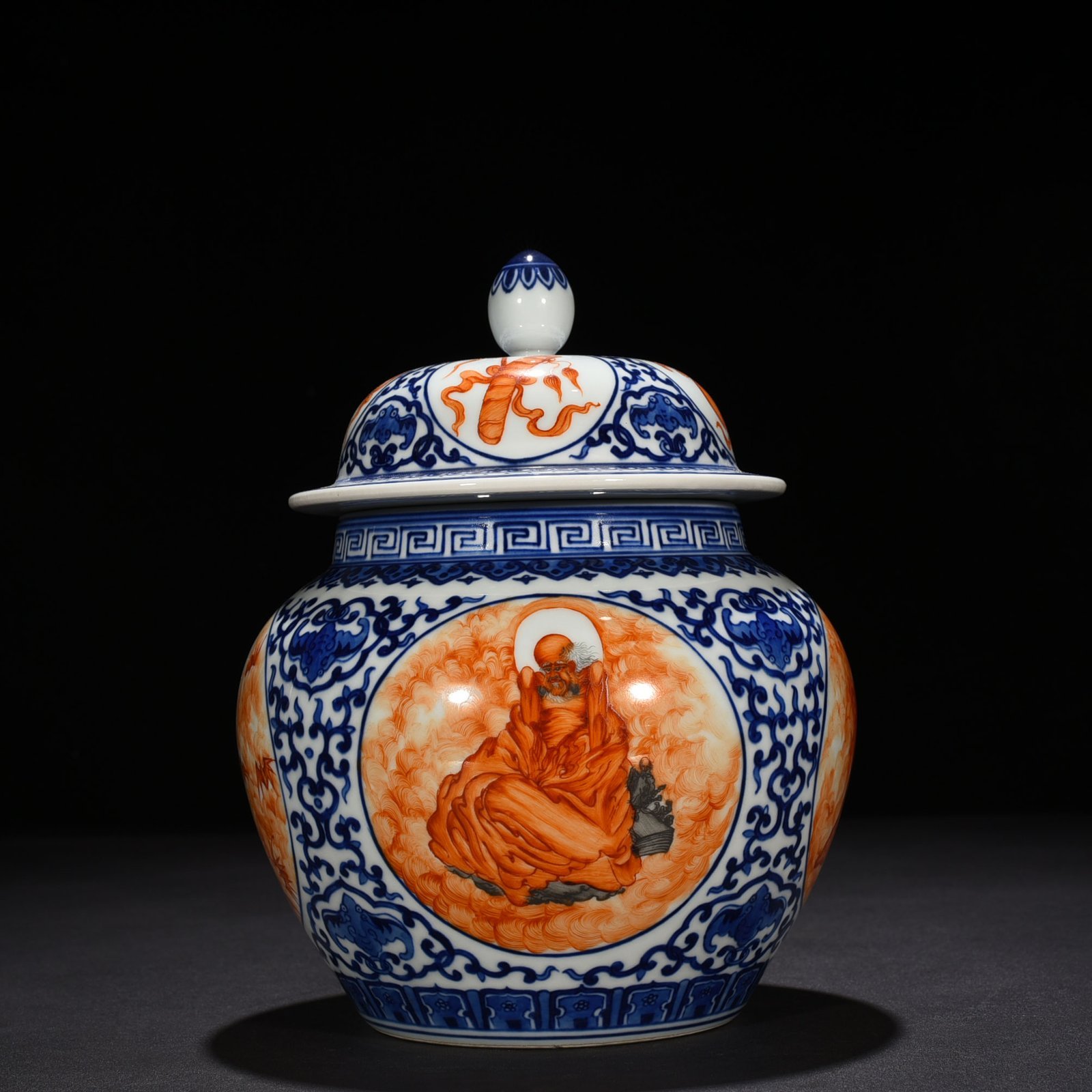 Qing Dynasty Qianlong blue and white windowed alum red Arhat general jar