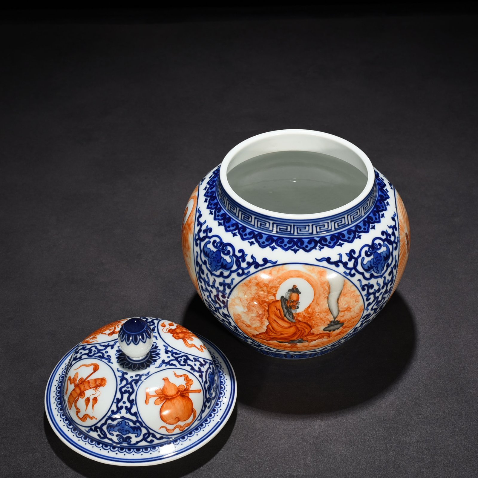 Qing Dynasty Qianlong blue and white windowed alum red Arhat general jar