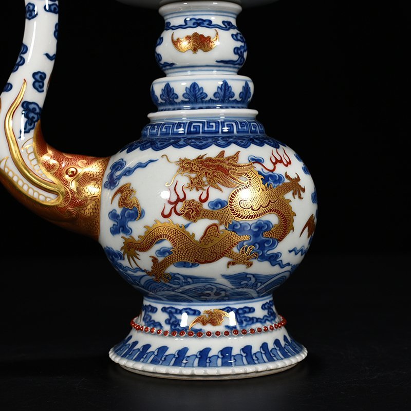Qing Dynasty Qianlong blue and white alum red Baba teapot