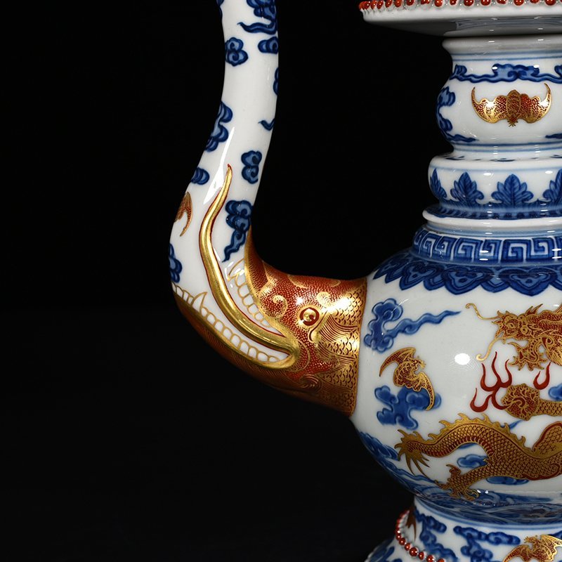Qing Dynasty Qianlong blue and white alum red Baba teapot